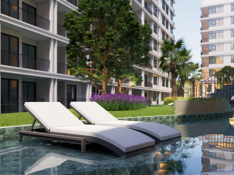 Architectural render of poolside loungers between the buildings at The Indeed Condo Pattaya, Pattaya