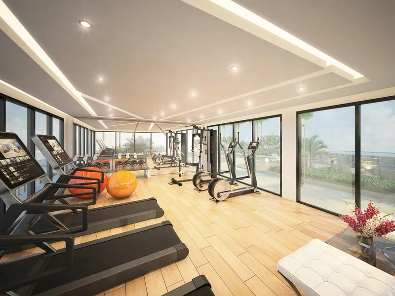 Architectural render of a gym with window-side cardio equipment at Siam Oriental Dream, Pattaya